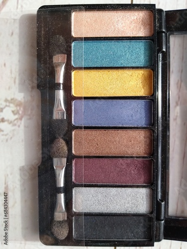 A palette of eye shadows in different bright colors © Varvara