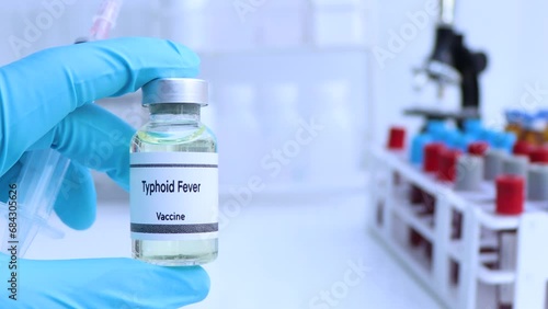 Typhoid Fever vaccine in a vial, immunization and treatment of infection, scientific experiment photo