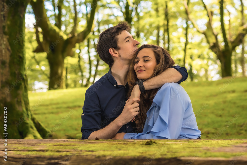 Tender scene of lovers embracing in a forest Tender scene of lovers embracing in a forest