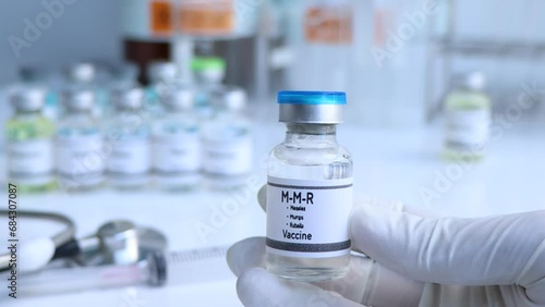Measles, Mumps, Rubella vaccine in a vial, immunization and treatment of infection, scientific experiment photo