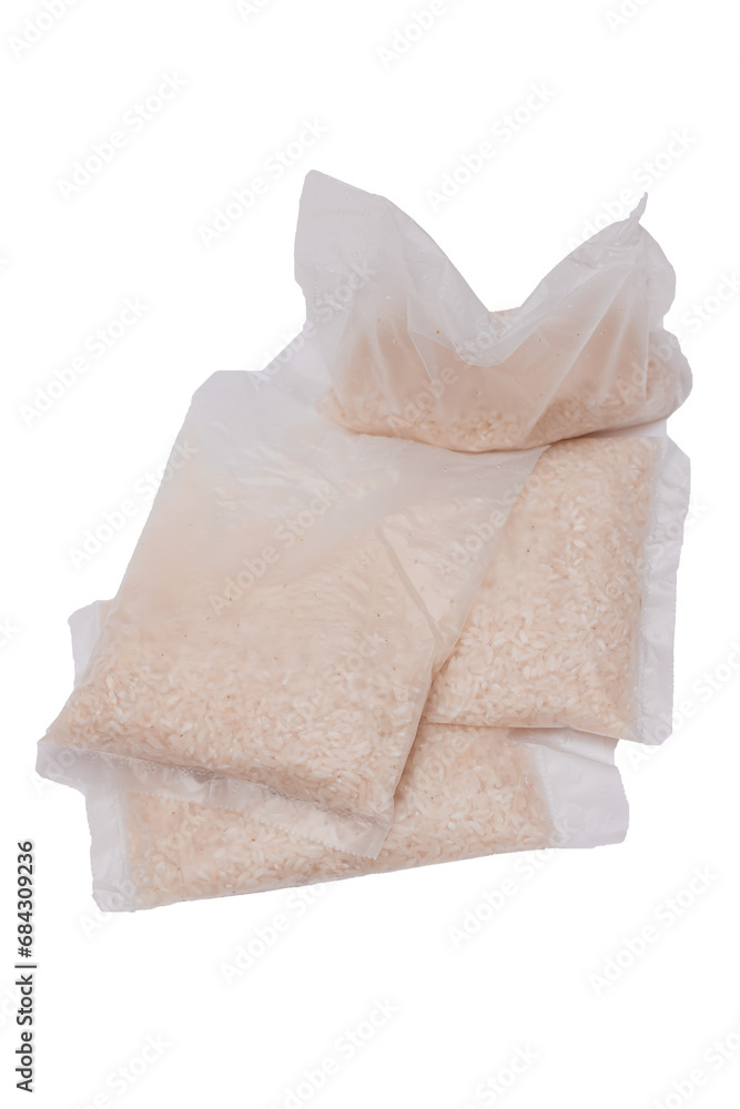 A Plastic Bags of White Long Grain Rice - Isolated on White Background. Small Transparent Packages with Dry Rice - Isolation A Plastic Bags of White Long Grain Rice - Isolated on White Background. Small Transparent Packages with Dry Rice - Isolation