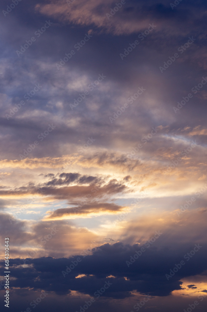 Fototapeta premium Evening sky. Yellow and violet clouds. Sunset in the clouds