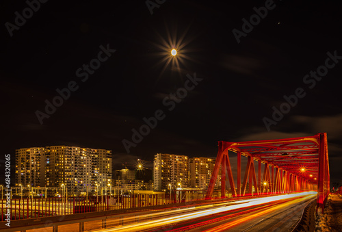 road bridge and modern residential skyscrapers in Gdansk Letnica at night photo