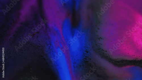 Paint drip. Glitter mist texture. Defocused neon blue purple pink black color sparkling ink water wave motion dark art abstract background.