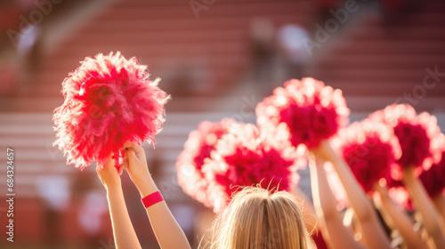 Cheerleader fitness, training and students in cheerleading uniform on a outdoor field. Athlete group back, college sport collaboration and game cheer prep ready for cheering, stunts and pompoms photo