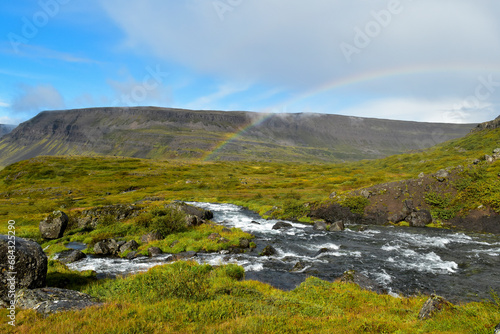 A rainbow arcs over the Iceland landscape after a heavy rain.