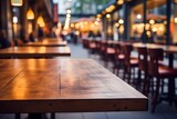 Cozy wooden round table with bokeh light on pub or bar background for a warm and inviting atmosphere