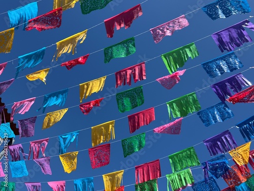 Colorful Papel Picado flags/banners hanging in the streets of Oaxaca, Mexico