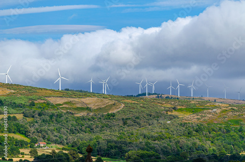 wind farm on top of a mountain peak