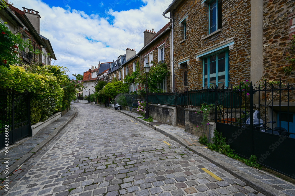 Paris, France.1 July 2022. Paris to discover: the quiet and pretty neighborhood called the countryside in Paris. A place that makes you think you are in a fairy tale with small brick houses.