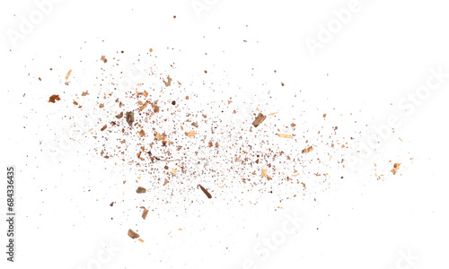 Wood pieces and dust, crushed tree bark isolated on white background, organic texture, top view photo