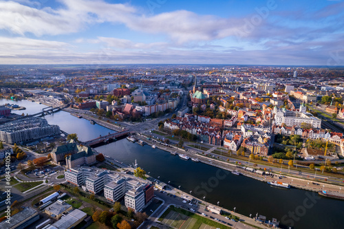 Szczecin from a bird's eye view on a sunny day. View of the city from the Oder River. City buildings, the seaport in Szczecin and its most characteristic places. © Olivier Uchmanski