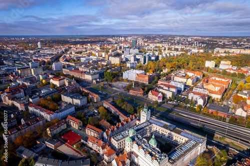 Szczecin from a bird's eye view on a sunny day. View of the city from the Oder River. City buildings, the seaport in Szczecin and its most characteristic places.