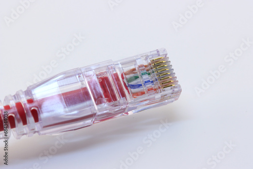 RJ45 connector for connecting an Ethernet signal. On a white background, close-up.