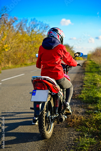 biker girl in red. red motorcycle.