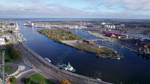 Szczecin from a bird's eye view on a sunny day. View of the city from the Oder River. City buildings, the seaport in Szczecin and its most characteristic places.