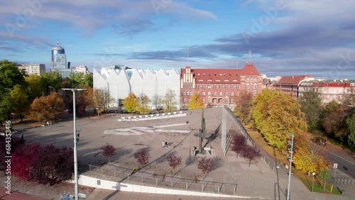 Szczecin from a bird's eye view on a sunny day. View of the city from the Oder River. City buildings, the seaport in Szczecin and its most characteristic places.