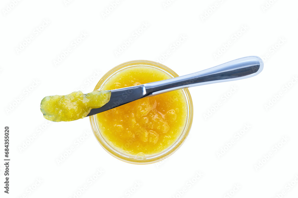 lemon jam in jar with knife isolated on white background, top view. lemon jam in jar with knife isolated on white background, top view.