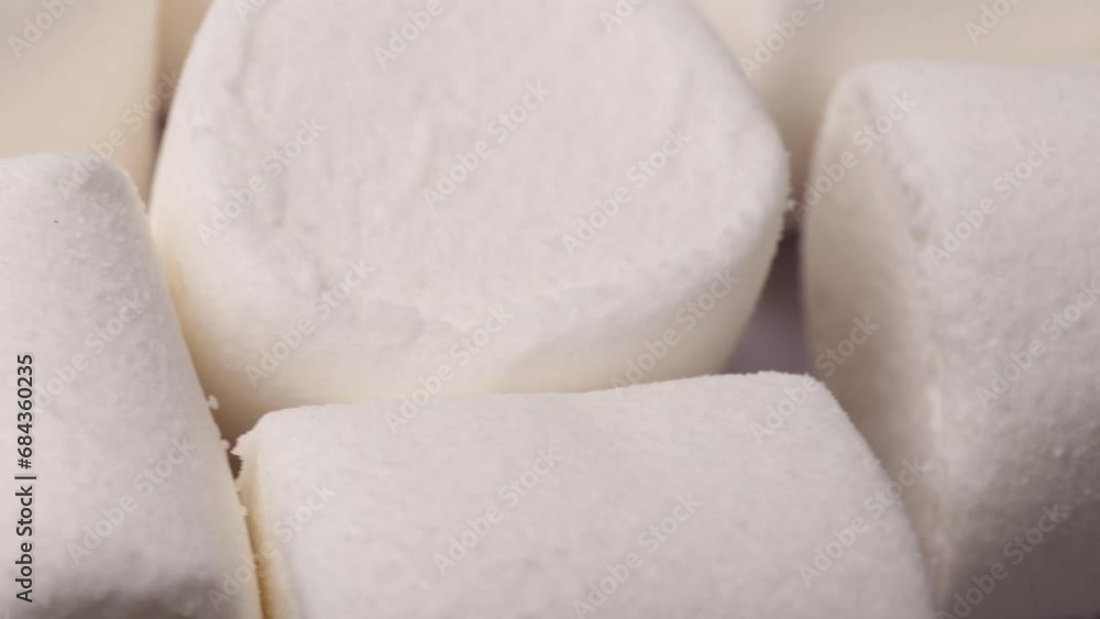 white marshmallow, rotation in circle. marshmallow for cocoa or for grilling, Turning. selective focus. view from above. white marshmallow, rotation in circle. marshmallow for cocoa or for grilling, Turning. selective focus. view from above.