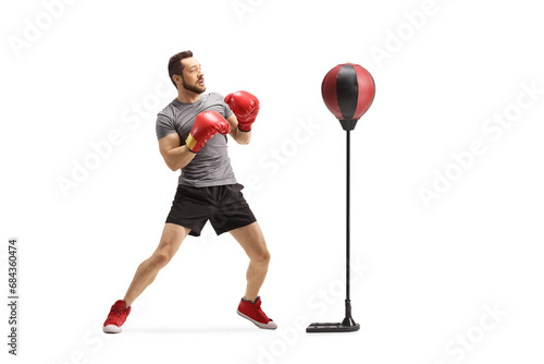 Man training box with a punch stand photo