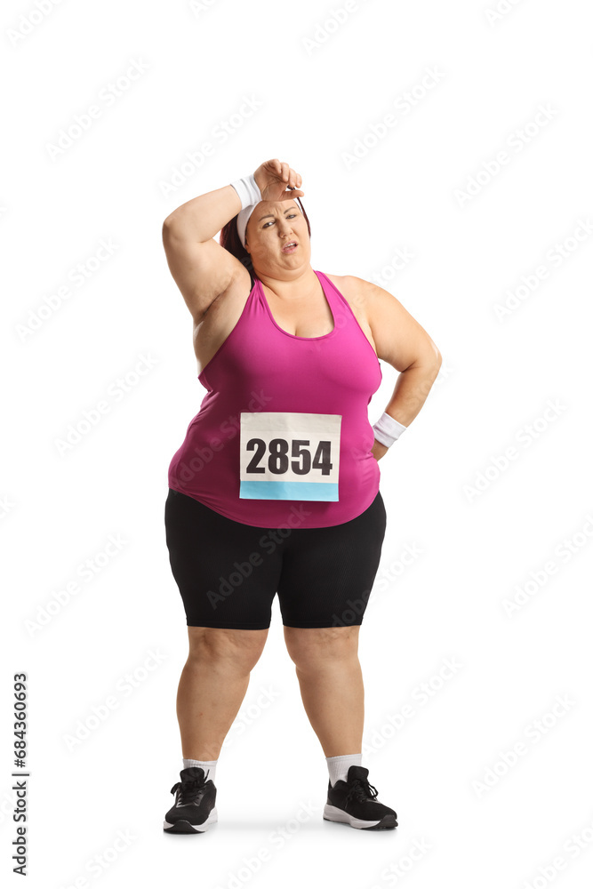 Exhausted corpulent woman resting at a marathon Exhausted corpulent woman resting at a marathon