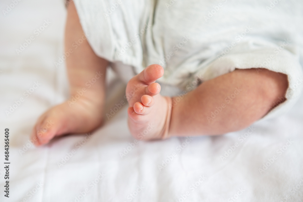 Small feet of a newborn baby. The concept of motherhood, breastfeeding. Small feet of a newborn baby. The concept of motherhood, breastfeeding.