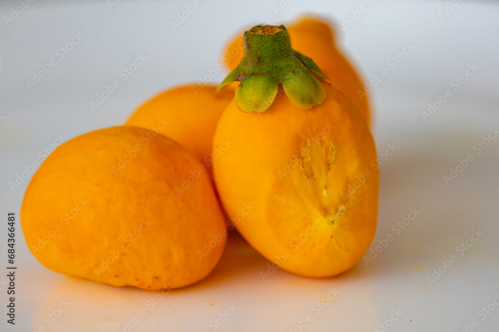 Typical ripe pequi fruit (caryocar brasiliense) in fine details and selective focus. Typical fruit from the Brazilian cerrado bioama.
