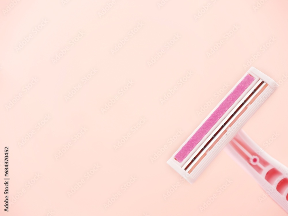 pink disposable razor and space to add text pink disposable razor and space to add text
