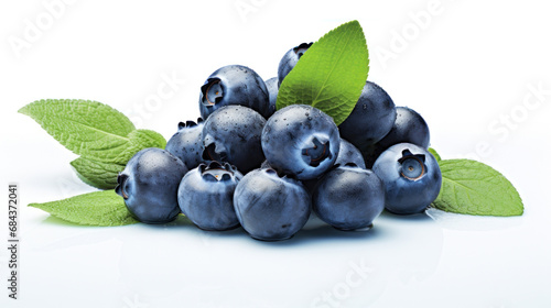 Fresh Blueberry on White Background. Close up of Blue berries with green leaves. Delicious healthy dessert rich in vitamins and minerals. Organic eco product. For label, poster, brochure, food blog