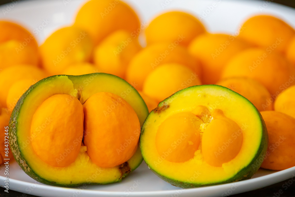 Typical ripe pequi fruit (caryocar brasiliense) in fine details and selective focus. Typical fruit from the Brazilian cerrado bioama.