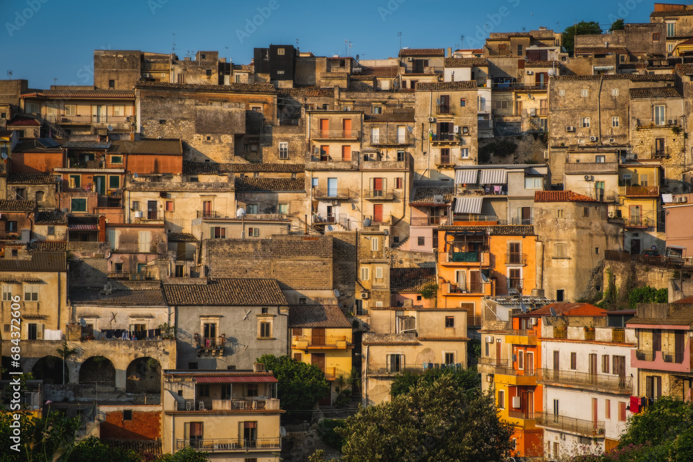 Italy, Sicily, Ragusa District, Monterosso Almo. June 2023. Amazing little houses that grew on top of each other. Evening hour.