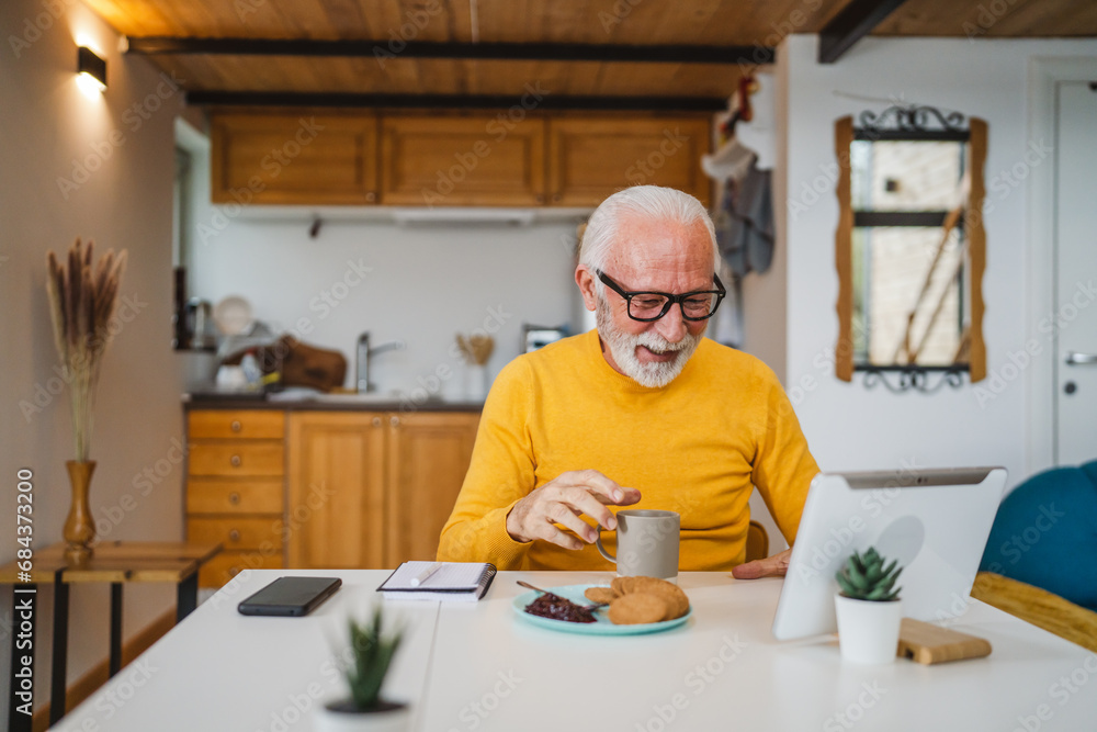 Senior caucasian man use digital tablet to make a video call at home Senior caucasian man use digital tablet to make a video call at home