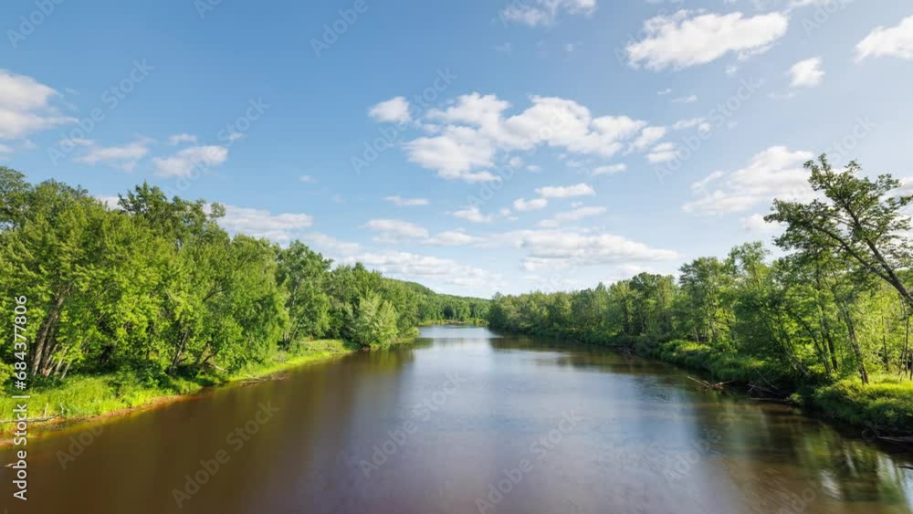 Time lapse of the clouds moving above Kettle River surrounded by forest in Minnesota. Time lapse of the clouds moving above Kettle River surrounded by forest in Minnesota.