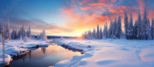 As the sun sets on a winter's day, the snow-covered landscape transforms into a pristine white canvas under the Christmas sky, where nature's beauty is showcased through the majestic forest and its © 2rogan
