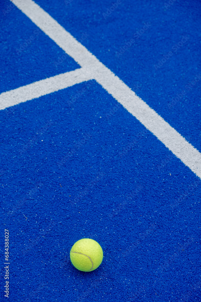 selective focus, a ball on a paddle tennis court.