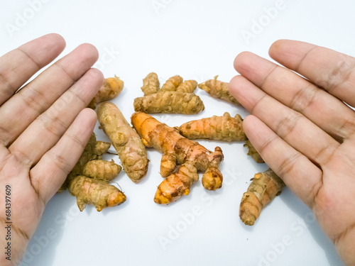 Turmeric roots on white background, herb and food ingredient for health