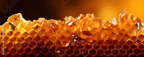 Honey dripping from honey comb, banner fresh honey photo