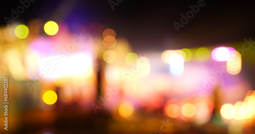 Colorful Bokeh abstract blurred background music festival stage show performance party. Vibrant bokeh background spark animate motion. Backdrop display with twinkling night life shape blinking light photo