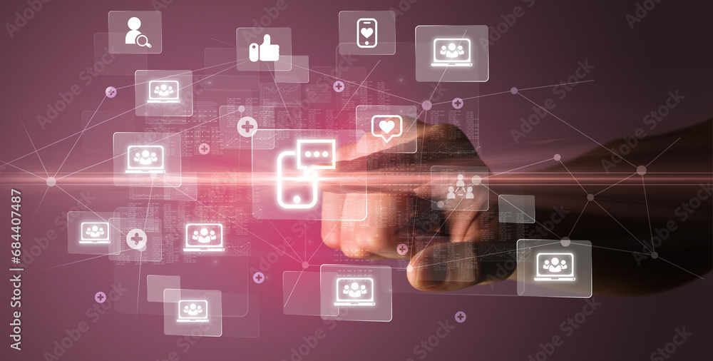 Hand pressing social media multimedia application screen with media icons on futuristic concept Hand pressing social media multimedia application screen with media icons on futuristic concept