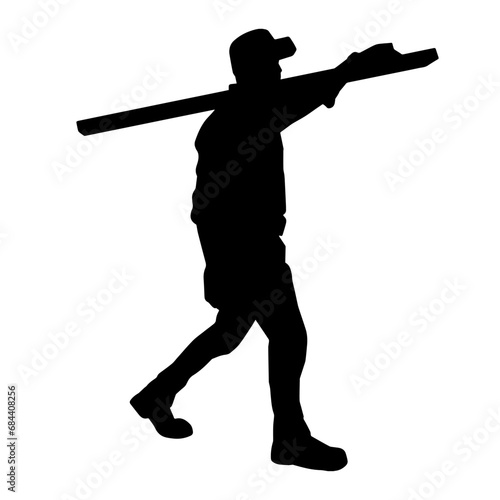 Silhouette of a male carpenter carrying wood beam.