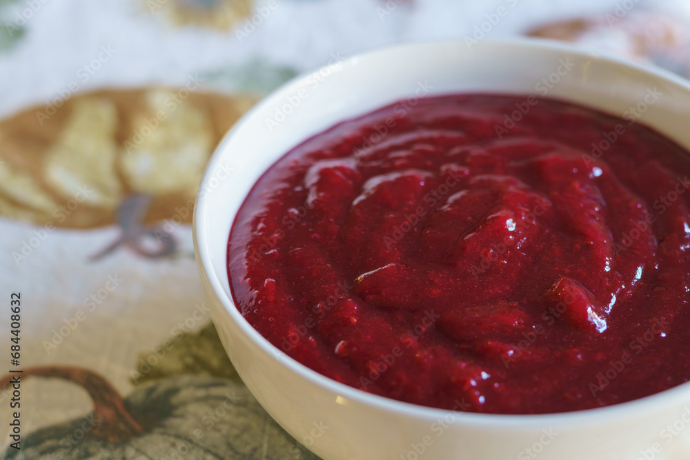 Cranberry sauce in a white bowl close-up Cranberry sauce in a white bowl close-up