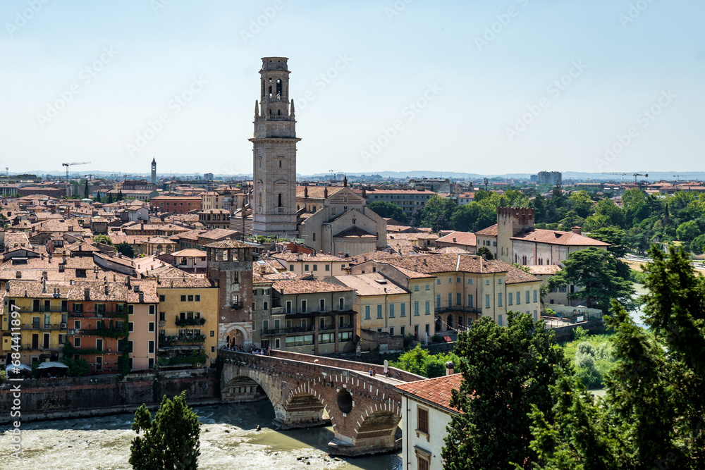 View of Verona city. Colorful residential buildings over Adige river in Verona, Italy