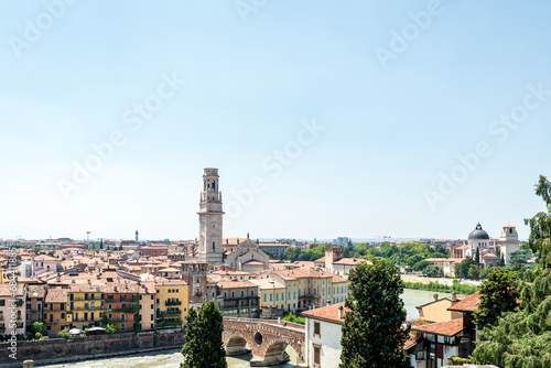 View of Verona city. Colorful residential buildings over Adige river in Verona, Italy © Renata