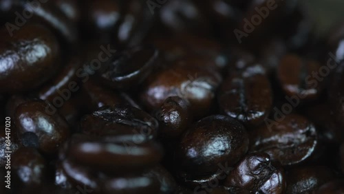 Coffee Beans spinning around in a container revealing the goodness of caffein when freshly brewed. photo