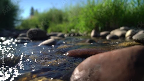 Stream flowing over rocks in Colorado summer  photo