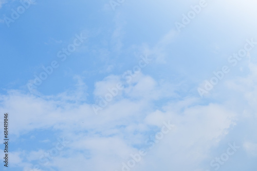beautiful blue sky and white fluffy cloud with sunrise in the morning, natural background