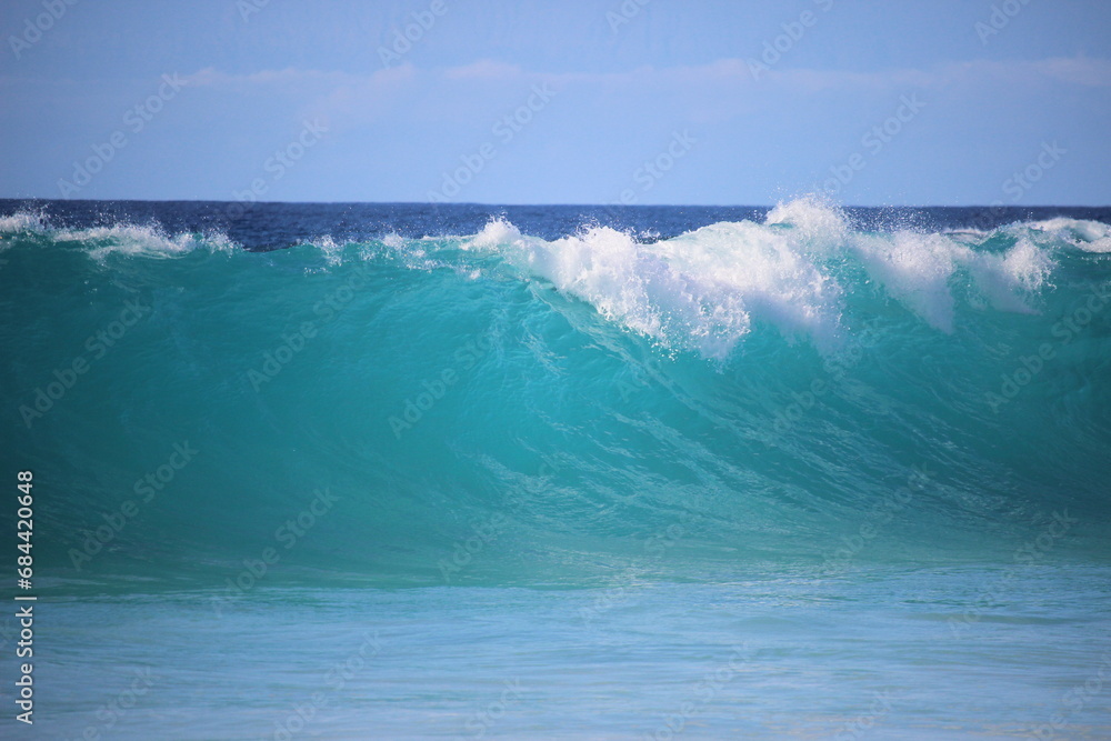 aquamarine waves crashing on the shoreline
