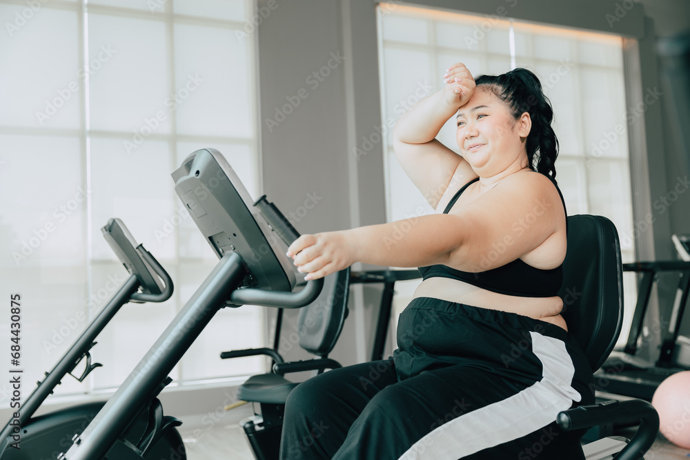 healthy fat women asian plus size lady doing workout exercise for lose weight body healthcare in sport club fitness