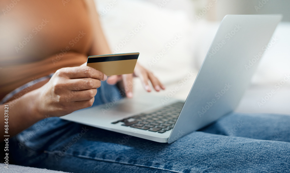 Fototapeta premium Laptop, credit card and hands for home online shopping, e commerce and digital payment or order on sofa. Relax person typing on computer for internet banking, subscription or registration for a loan