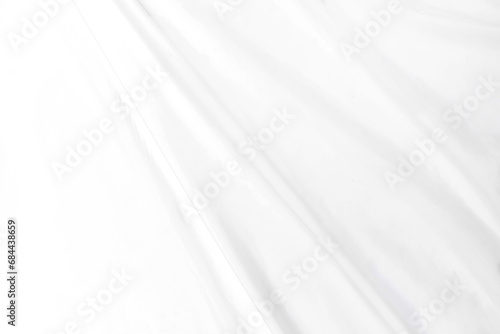 Abstract white fabric texture background Cloth soft wave. Creases of satin, silk, and cotton.